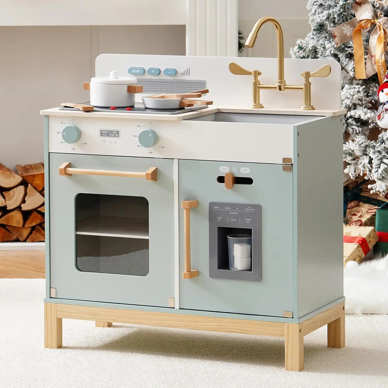 Children's play kitchen set with stove, sink, and oven in a home setting.