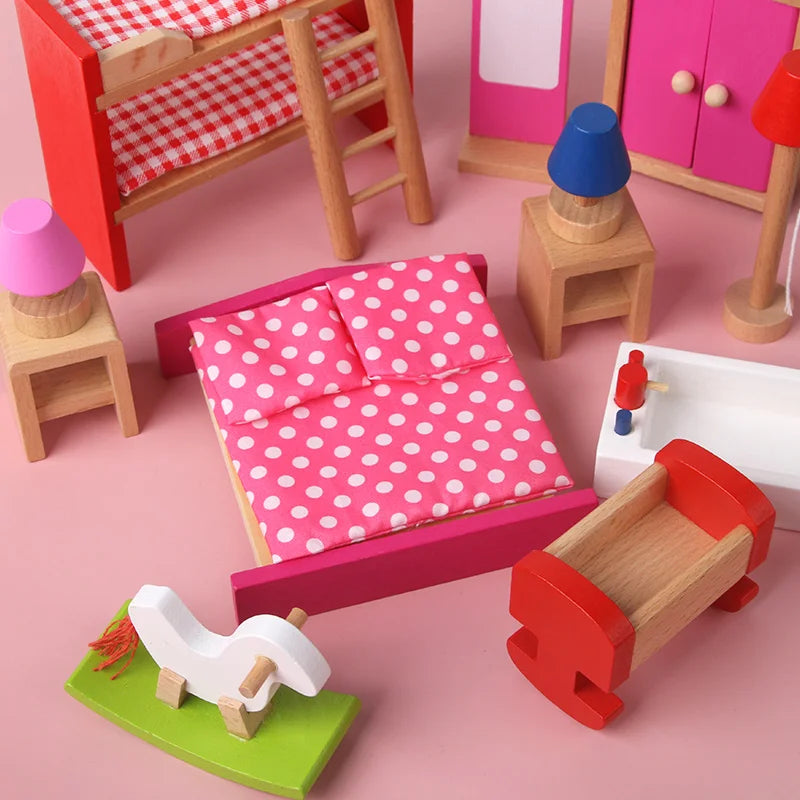 Wooden toy furniture set on a pink background, including a bed with polka dot bedding and a rocking horse.