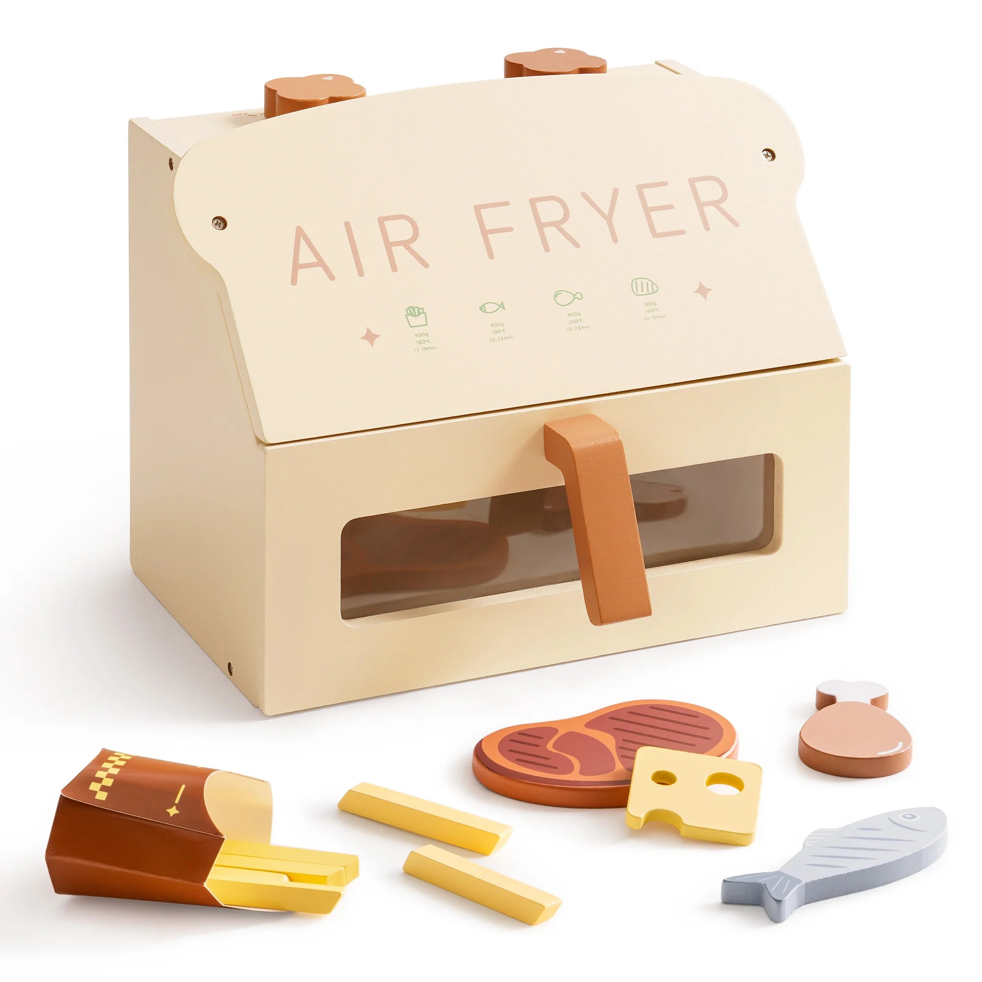 Toy air fryer with food items on a white background
