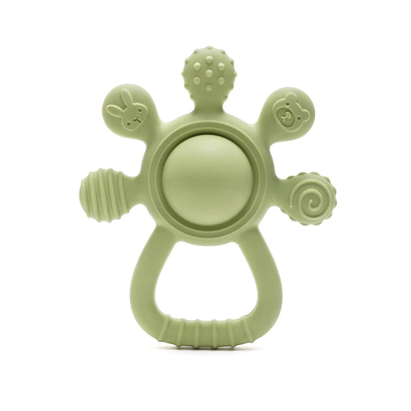 Green teething ring with textured surface on a white background