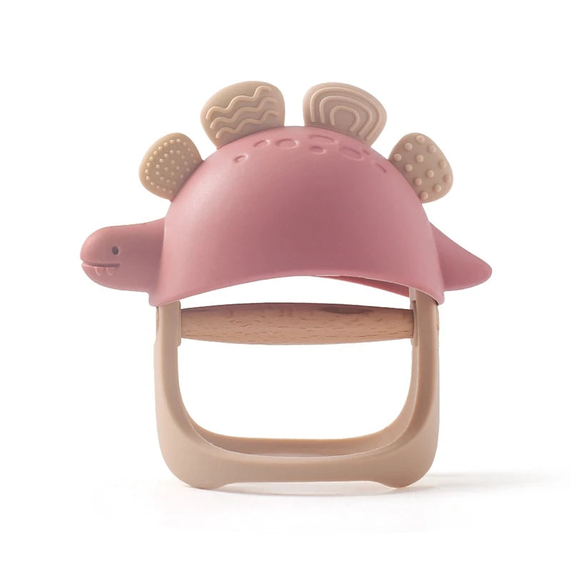 Pink and beige baby teether with dinosaur design on a white background