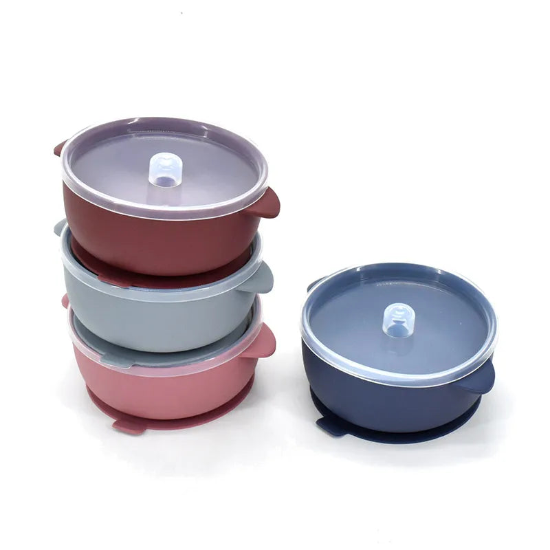 Stack of suction bowls with clear lids