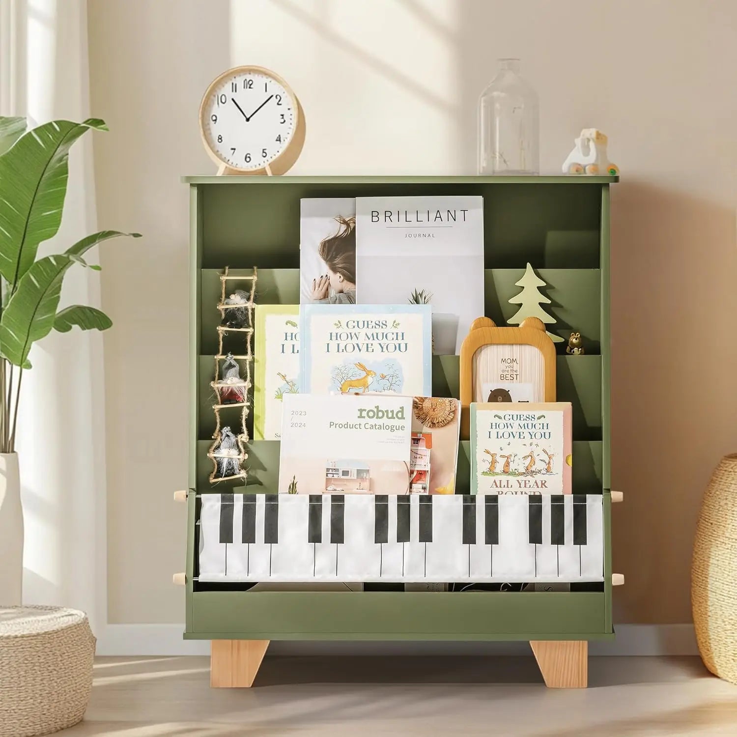 Green kids bookshelf with books and decorative items on a shelf.