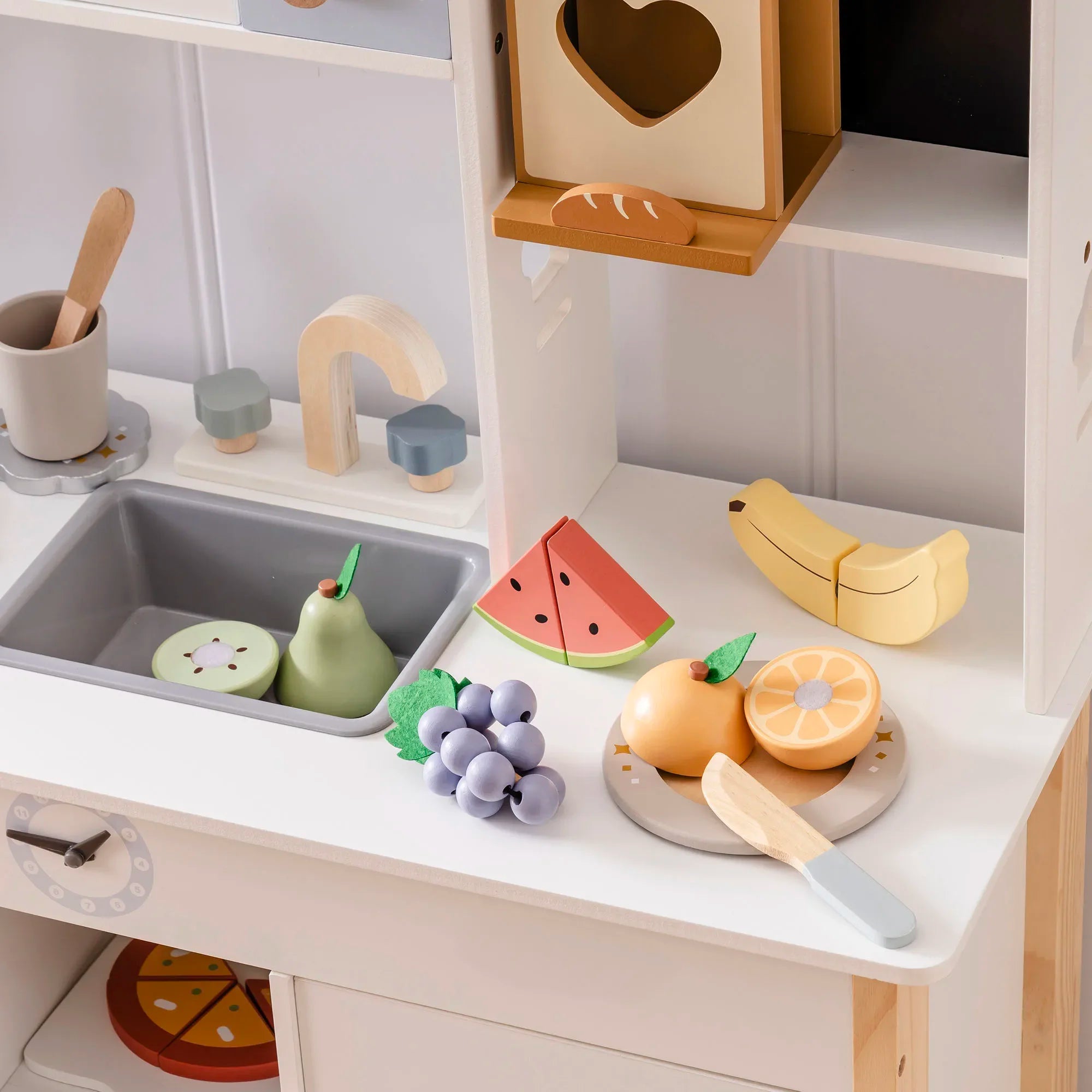 Wooden fruit on a kitchen counter