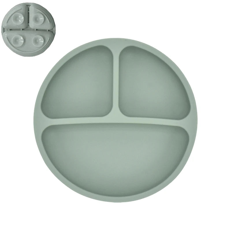 Green silicone plate with three sections on a white background