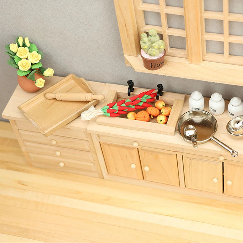 Wooden toy kitchen set with sink, cutting board, and vegetables on a neutral background