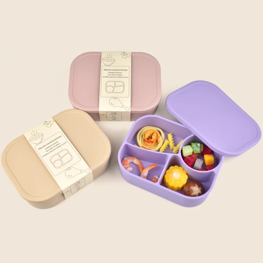 Packed lavender bento box beside closed boxes