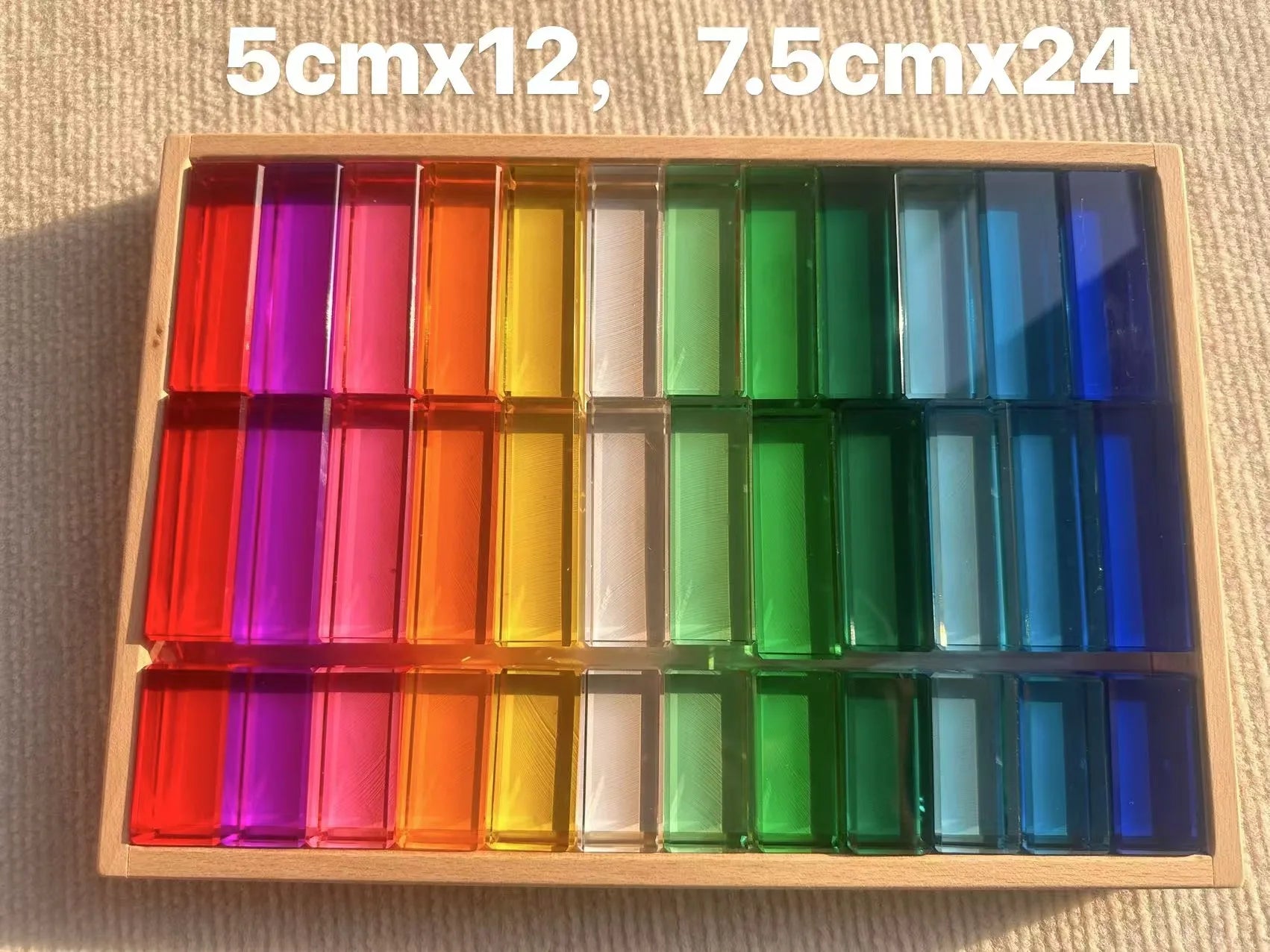 Colorful rectangular blocks in a wooden box with dimensions labeled.