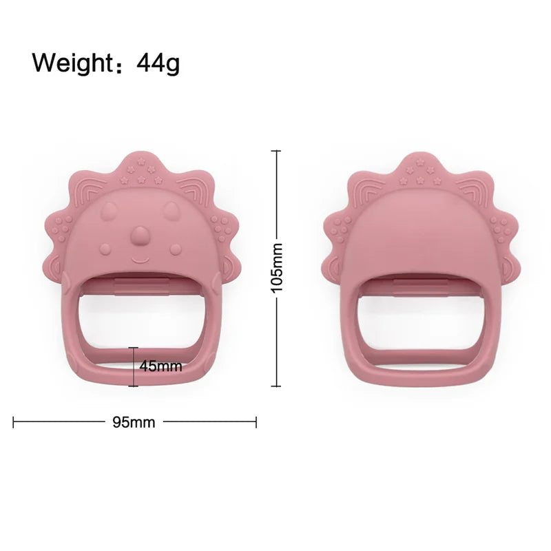 Pink dinosaur-shaped baby teether with measurements and weight on a white background