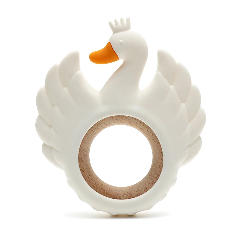 White swan-shaped teething ring with a wooden ring on a white background