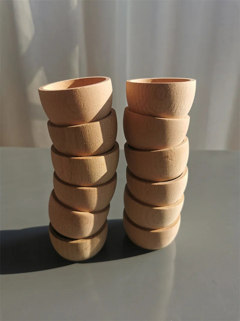 Stacks of wooden bowls on a neutral background