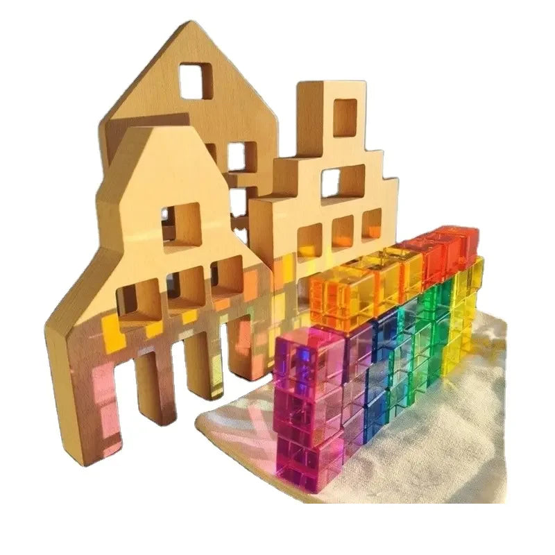 Colorful woodenbuilding blocks with a gold architectural model on a white background