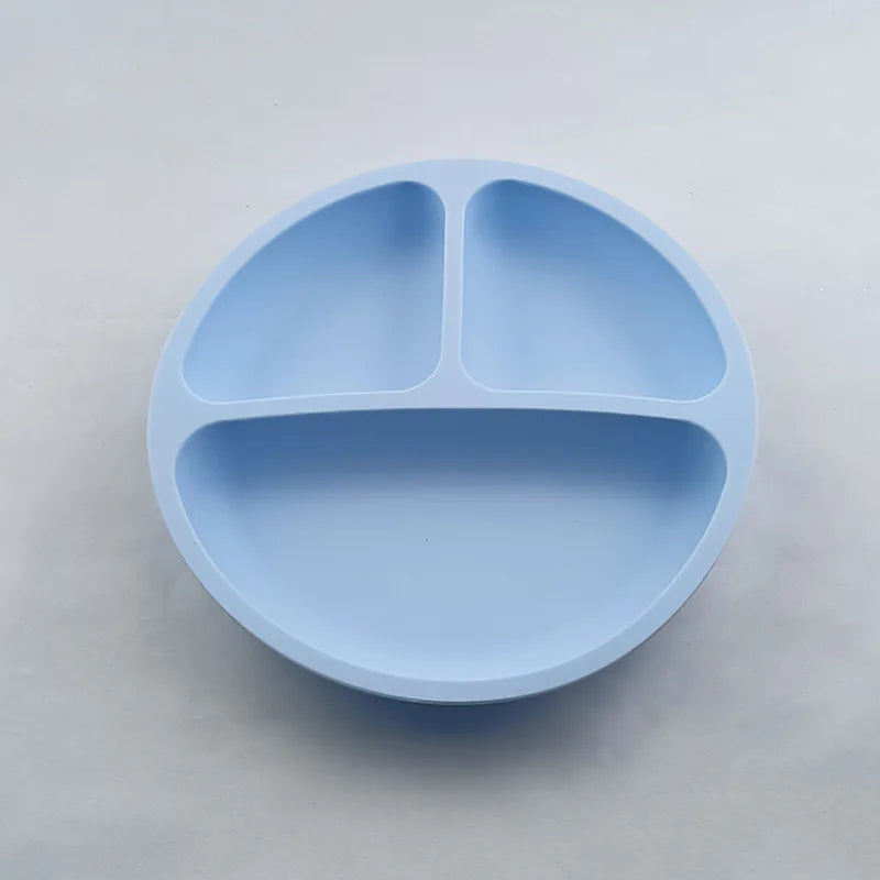 Light blue silicone plate with three sections on a light gray background