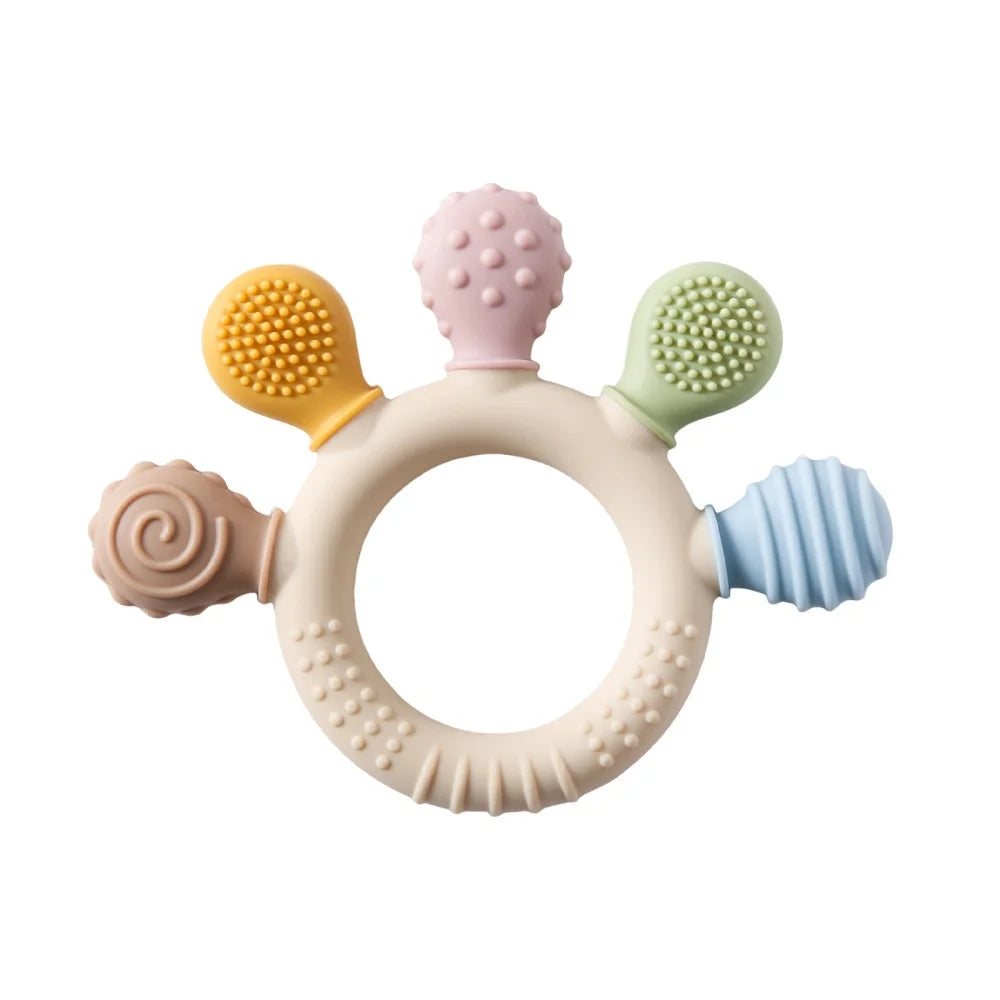 Colorful baby teething ring with multiple textures on a white background