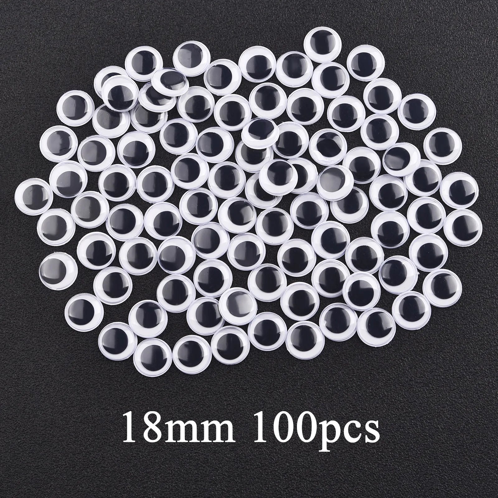 Movable Googly Eyes - Kindergarten Craft Supplies: A collection of various-sized googly eyes on a black background, ideal for enhancing children's art and craft projects.