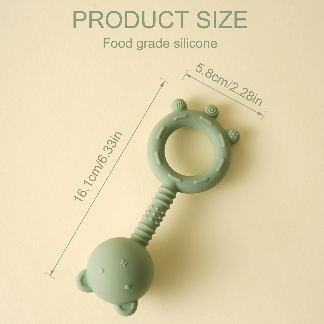 Green silicone teething ring with measurements on a beige background