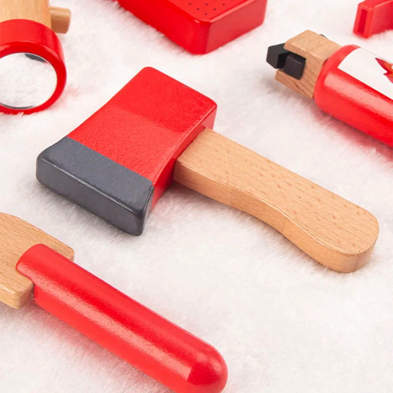 Set of red and wooden toy tools on a white background