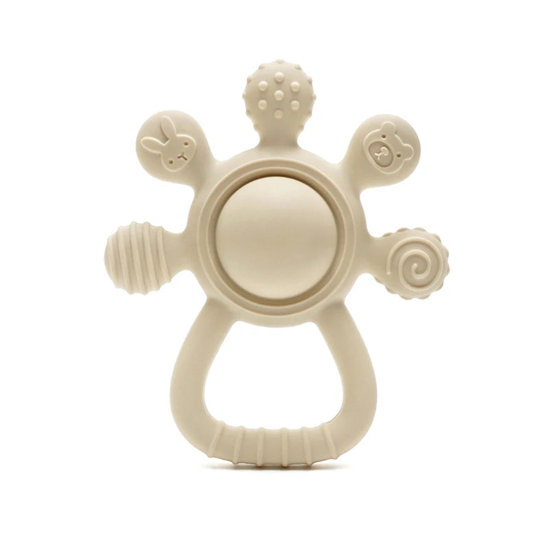 Beige baby teething ring with textured surface on a white background