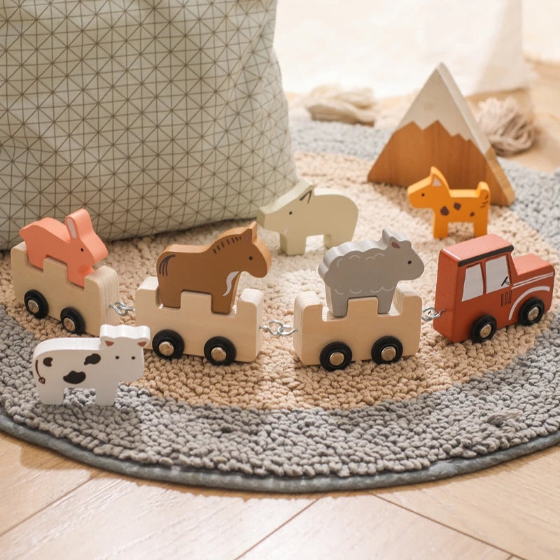 Farm animal train lined up on a play rug