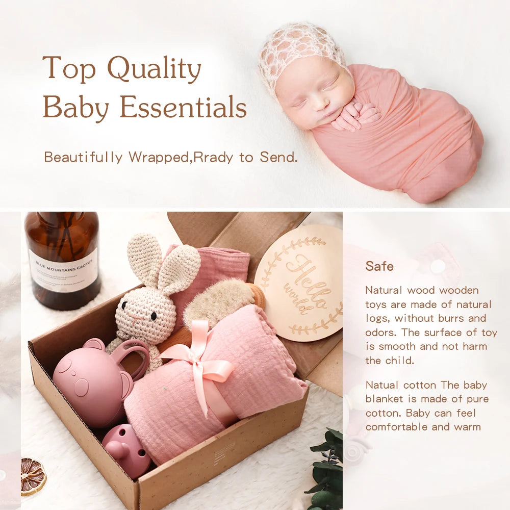 Baby gift set with pink baby blanket, wooden toys, and baby bottle on a white background.