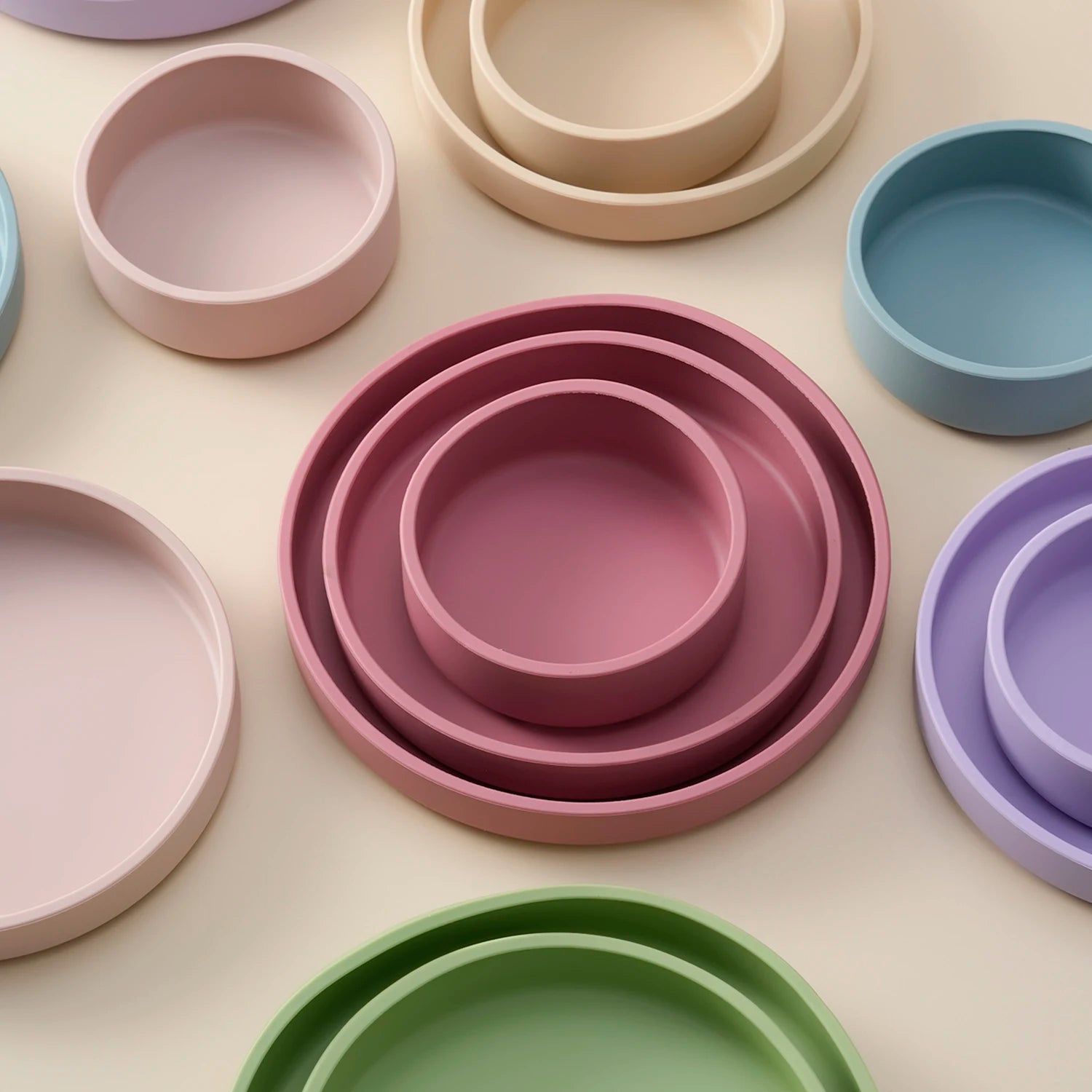 Silicone nesting plates in rose, sand, blue, lavender and green