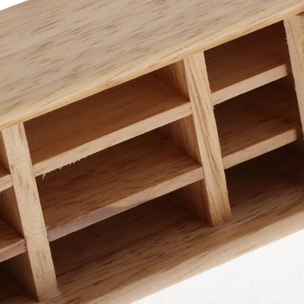 Wooden model of a building with multiple compartments on a white background