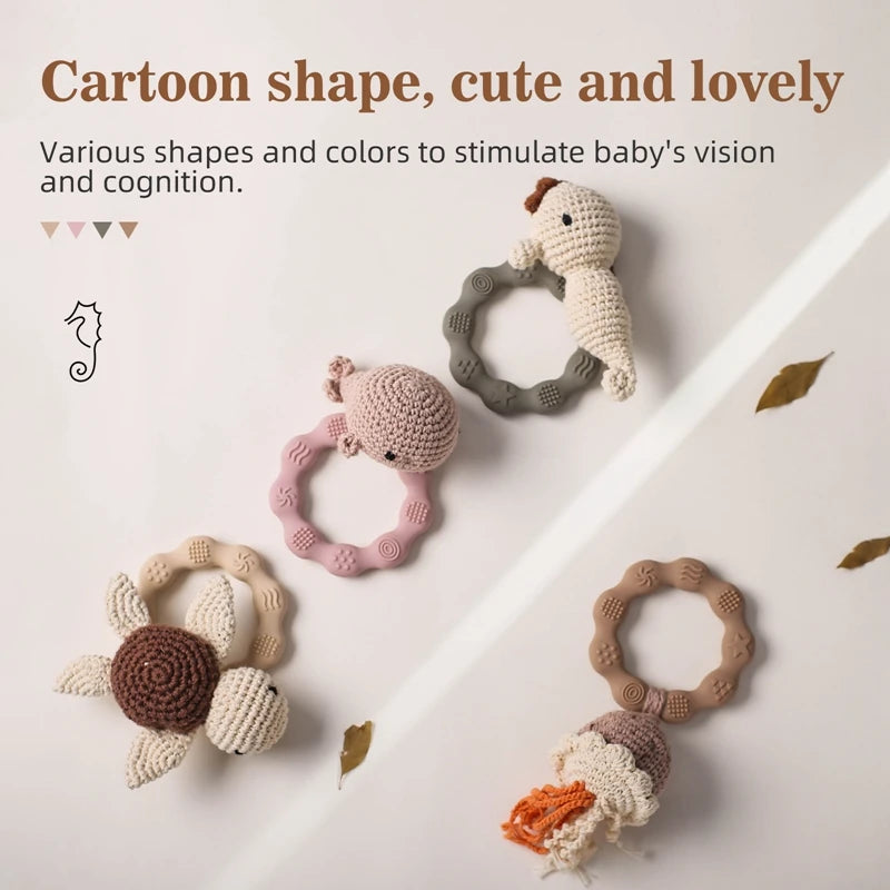 Set of crochet baby toys with cartoon shapes on a light background