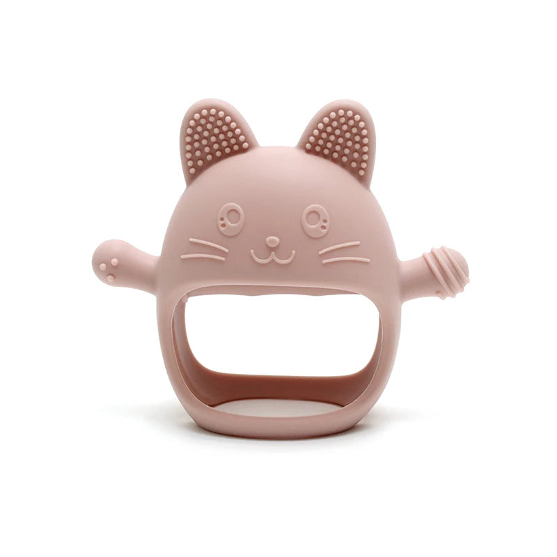 Pink cat-shaped brush on a white background