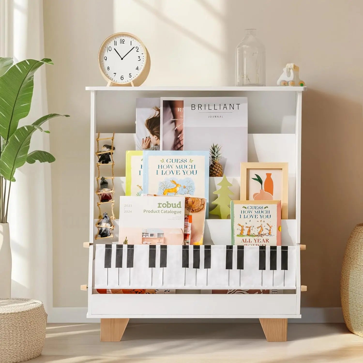 White bookshelf with books and decorative items in a room with a clock and plant.