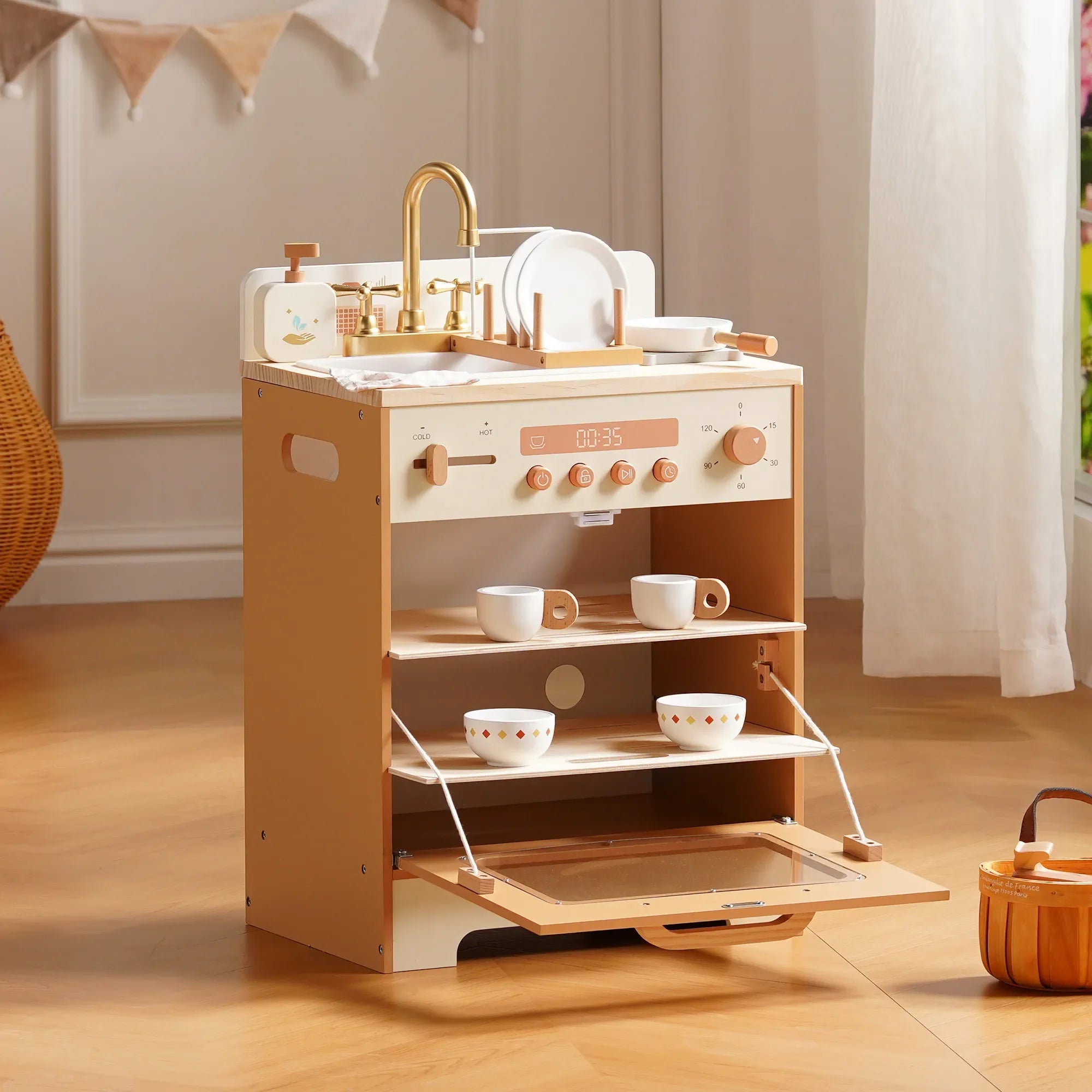 Children's play kitchen set with sink, stove, and shelves on a wooden floor.