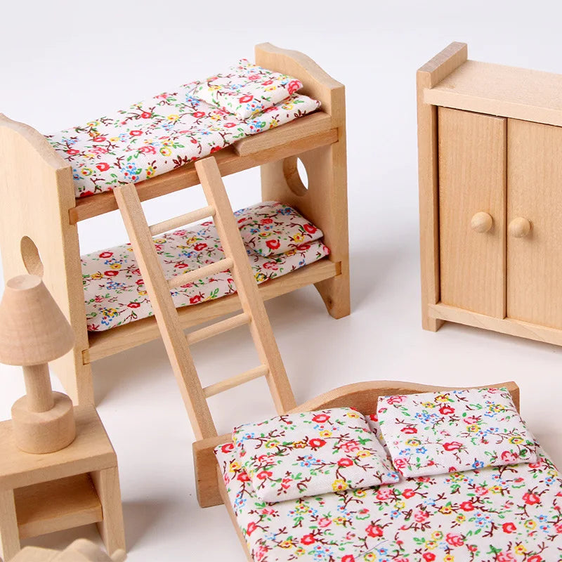 Wooden dollhouse furniture set with floral bedding on a white background