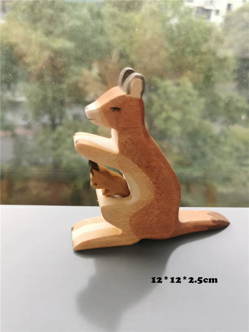 Wooden kangaroo figurine on a reflective surface with a blurred green background
