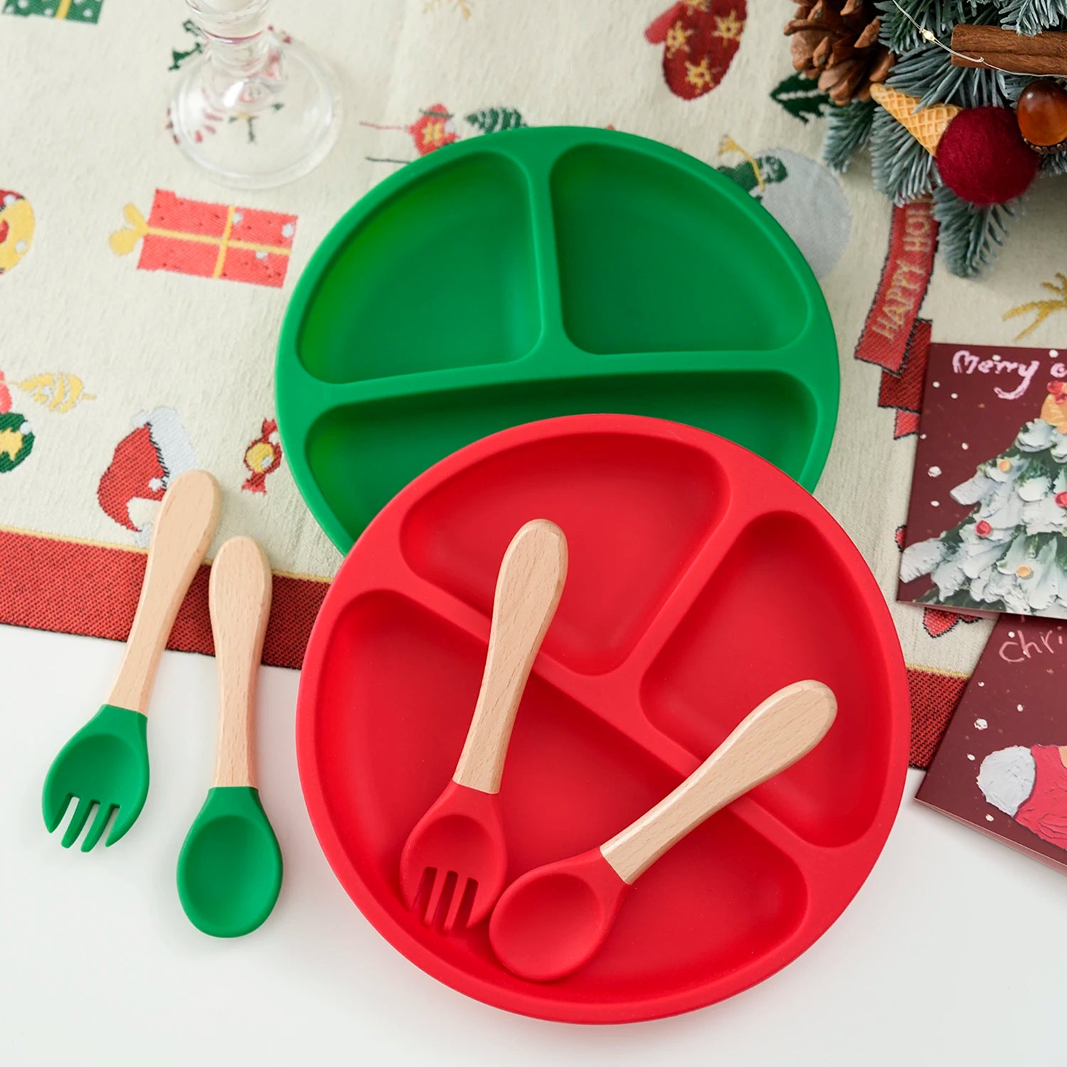 Red and green silicone divided plates with matching wooden handle spoon and fork sets