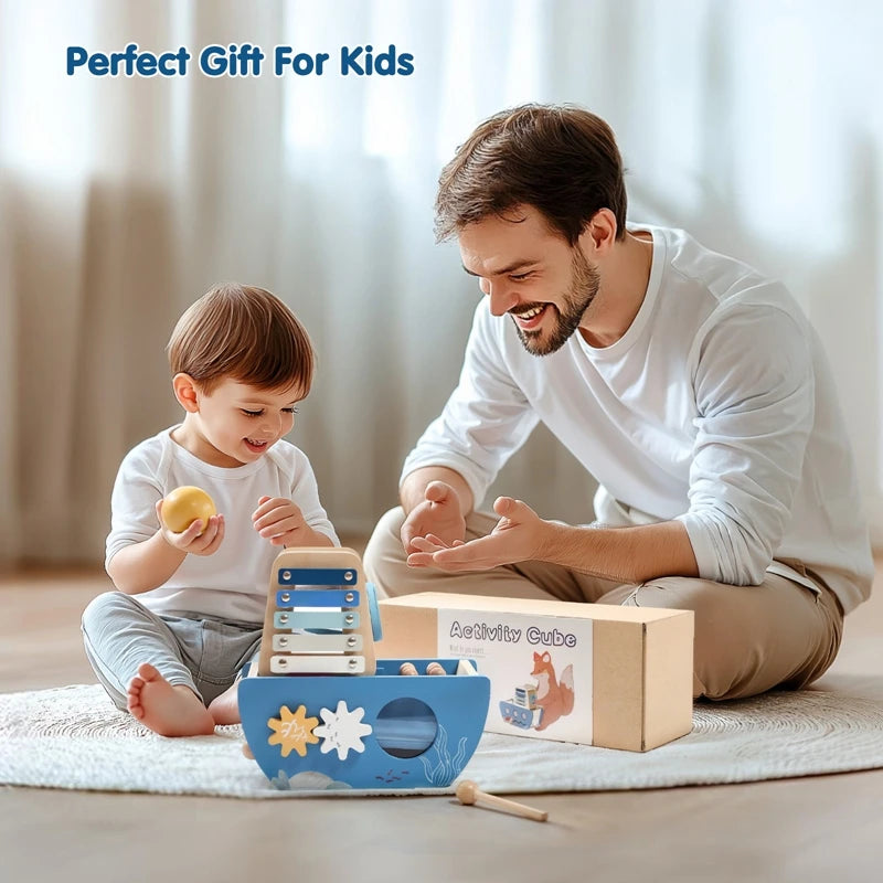 Man and child playing with educational toys on a light-colored floor.