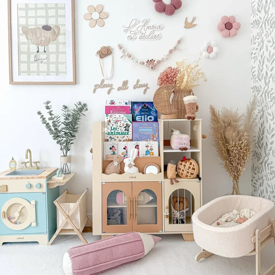 Children's bookshelf with books and toys in a room setting