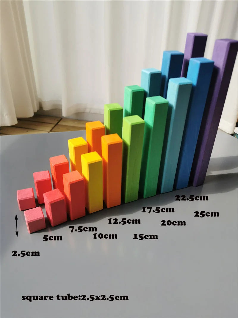 Colorful foam blocks arranged in a bar graph pattern on a gray surface with measurements.