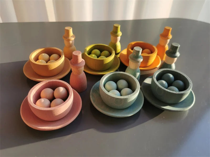 Set of colorful wooden toys on a gray surface