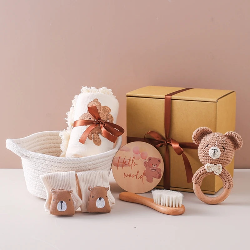 Baby Bath Towel Gift Set featuring a soft towel, crochet rattle, wool brush, and wooden milestone discs, ideal for newborn celebrations and sensory play.