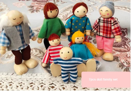 Wooden dolls dressed in colorful clothing on a patterned surface