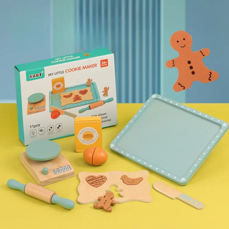 Children's cookie making set with tools and a tray on a yellow surface, featuring the Kape brand.