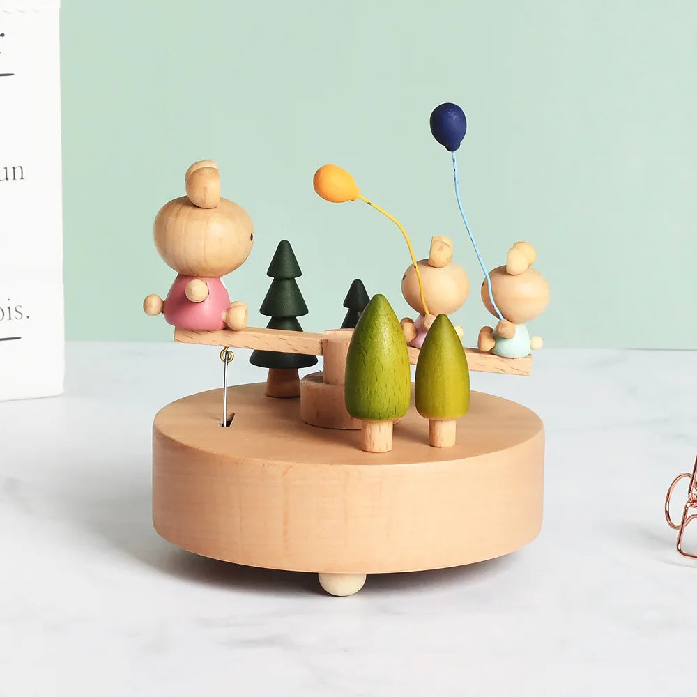 Wooden toy with children and trees on a light green background