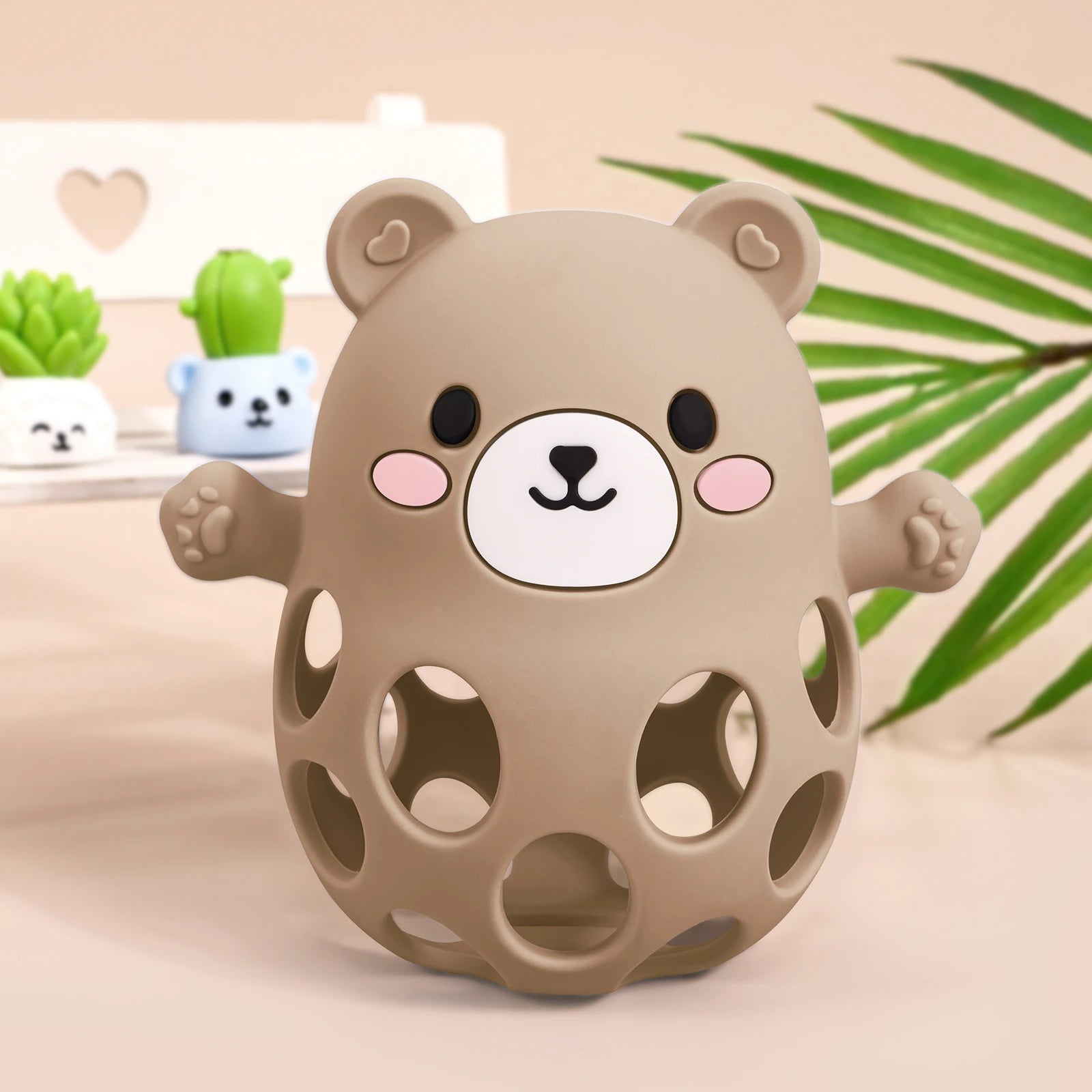 Brown bear-shaped toy with a face on a beige background