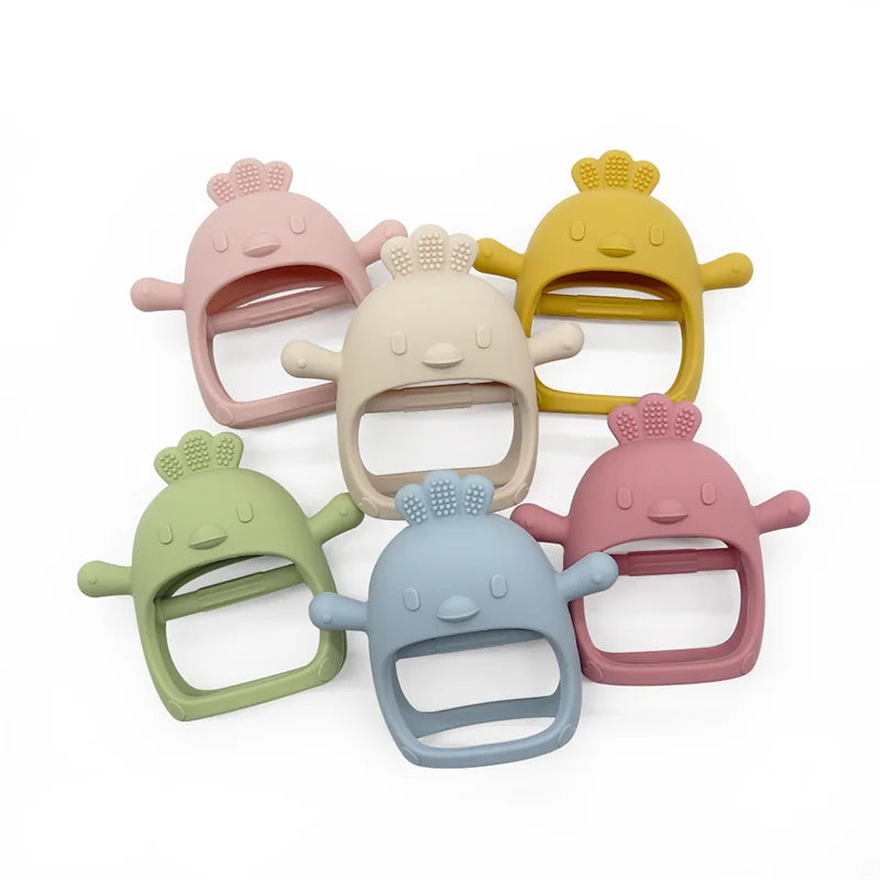 Set of colorful baby teething toys on a white background