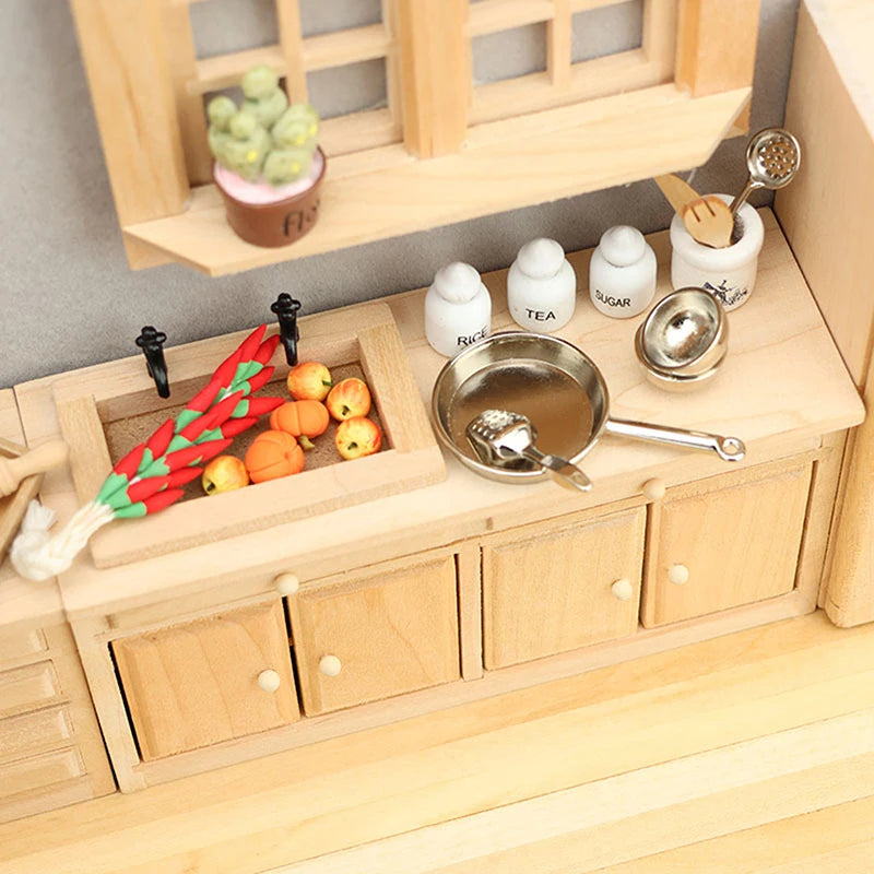 Wooden kitchen set with miniature pots, pans, and ingredients on a wooden surface.