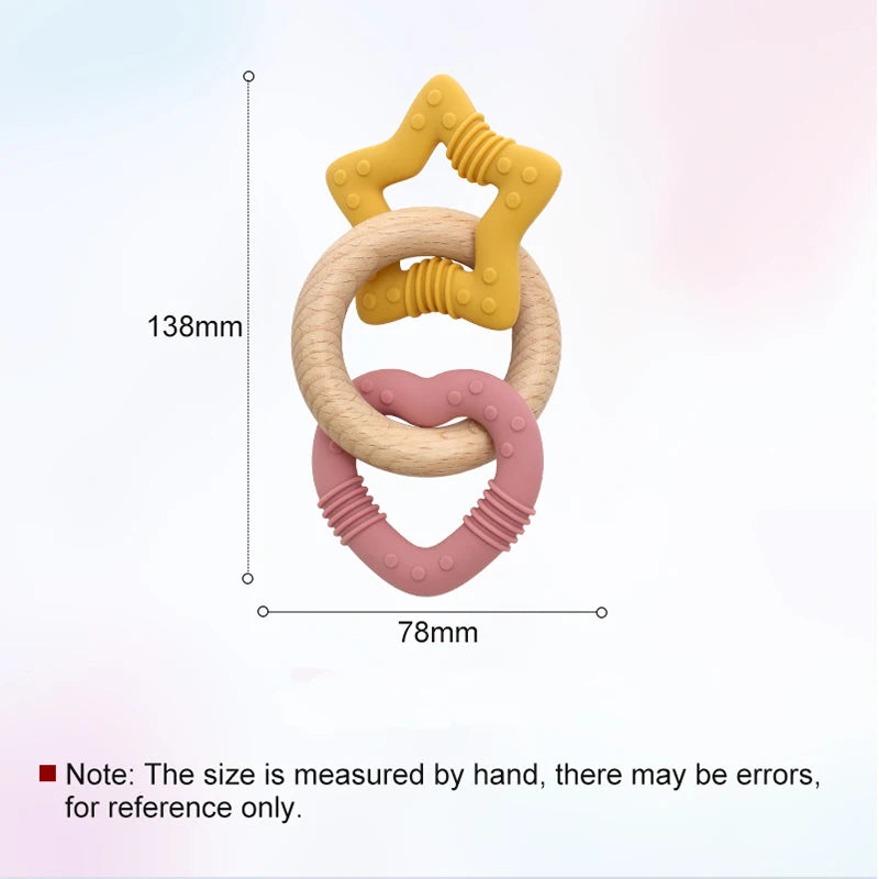 Colorful baby teething ring with measurements on a light pink background