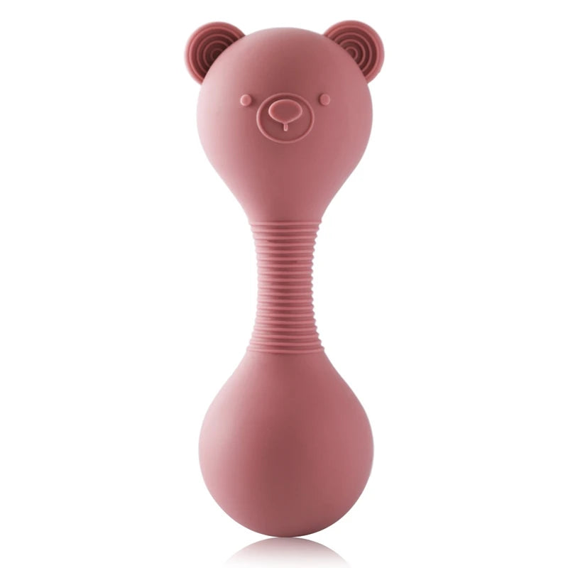 Pink rattle toy shaped like a bear on a white background