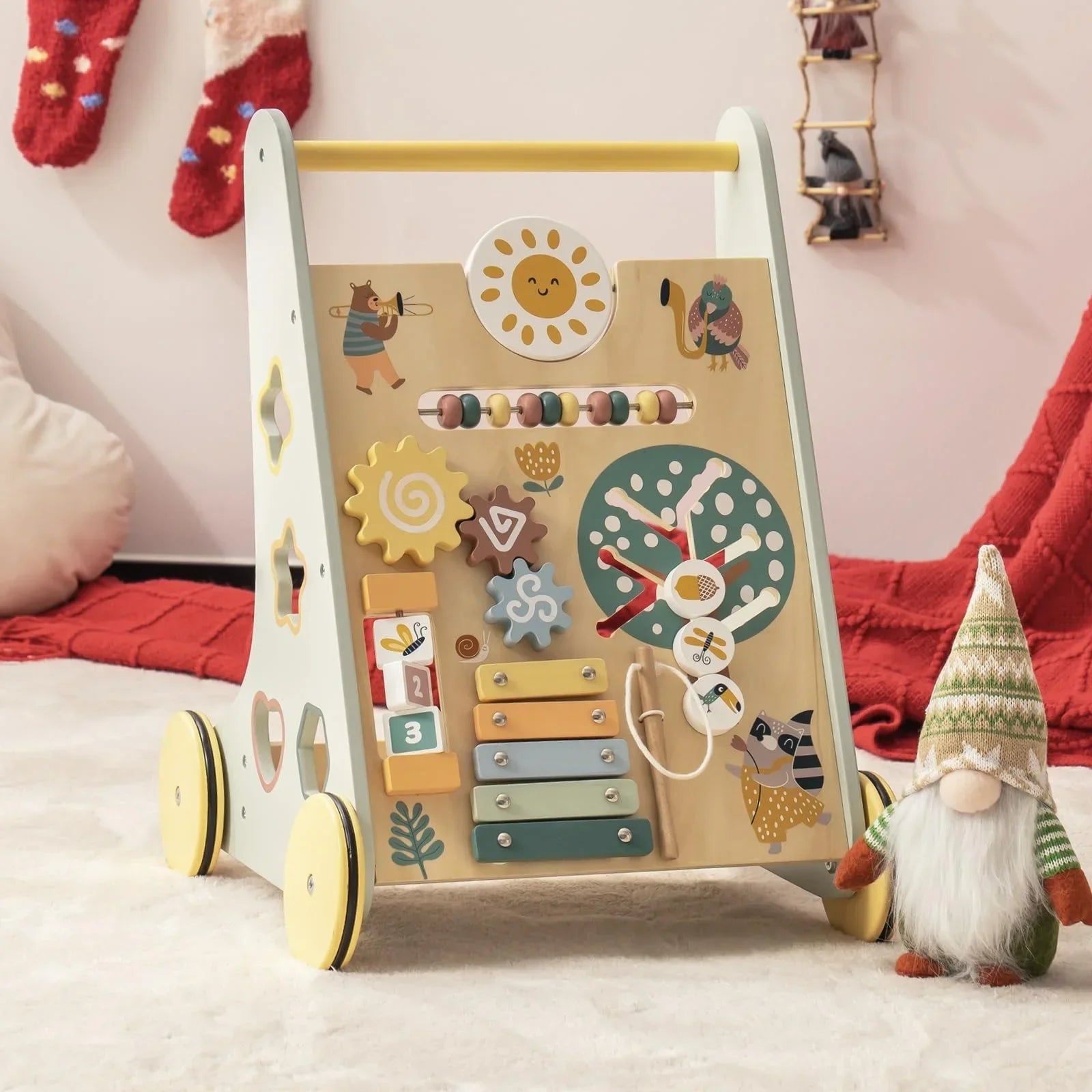 Children's activity toy with various educational elements on a soft surface.