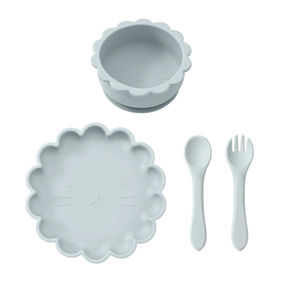 Set of light gray children's plate, bowl, spoon, and fork on a white background