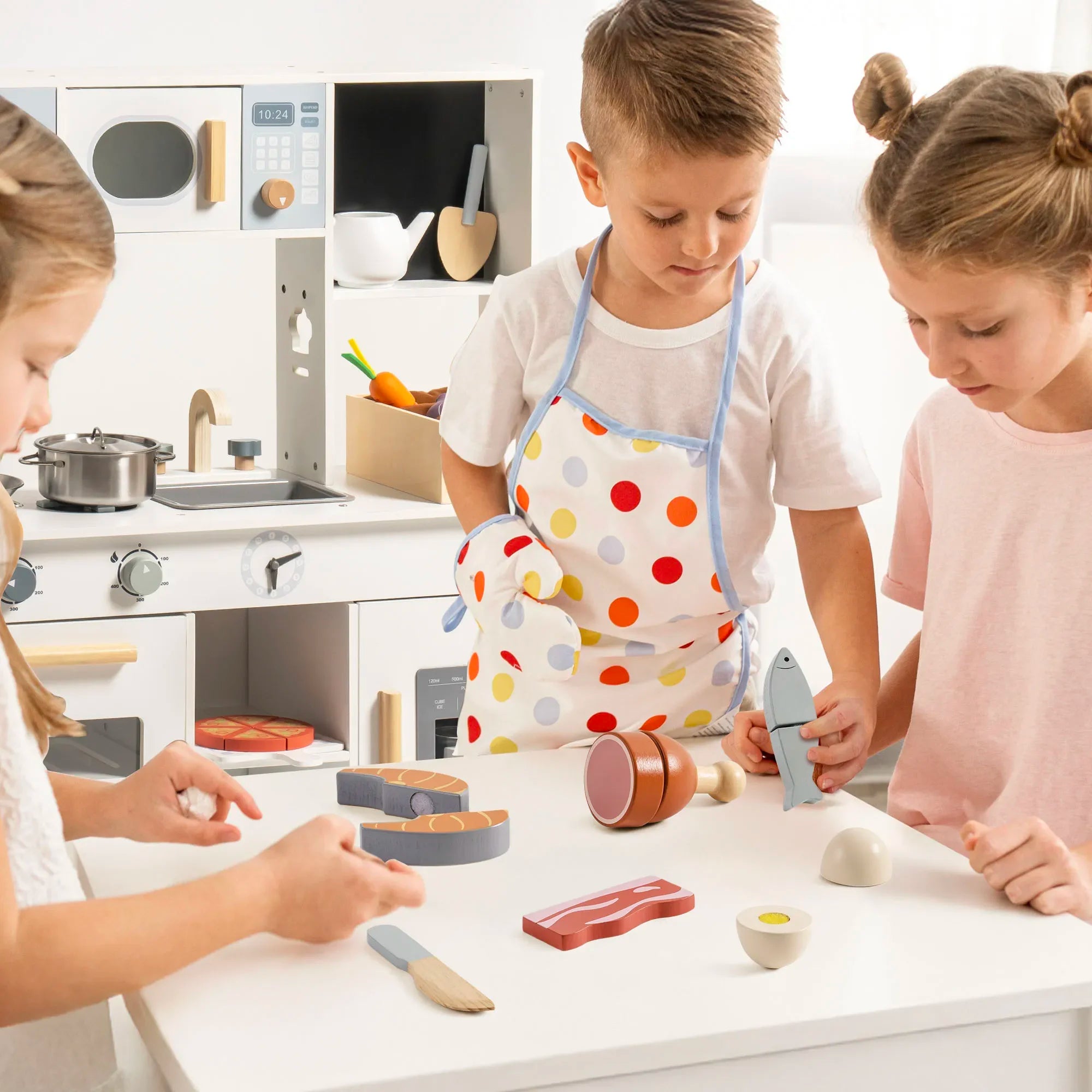 Children playing with toy kitchen set in a bright kitchen