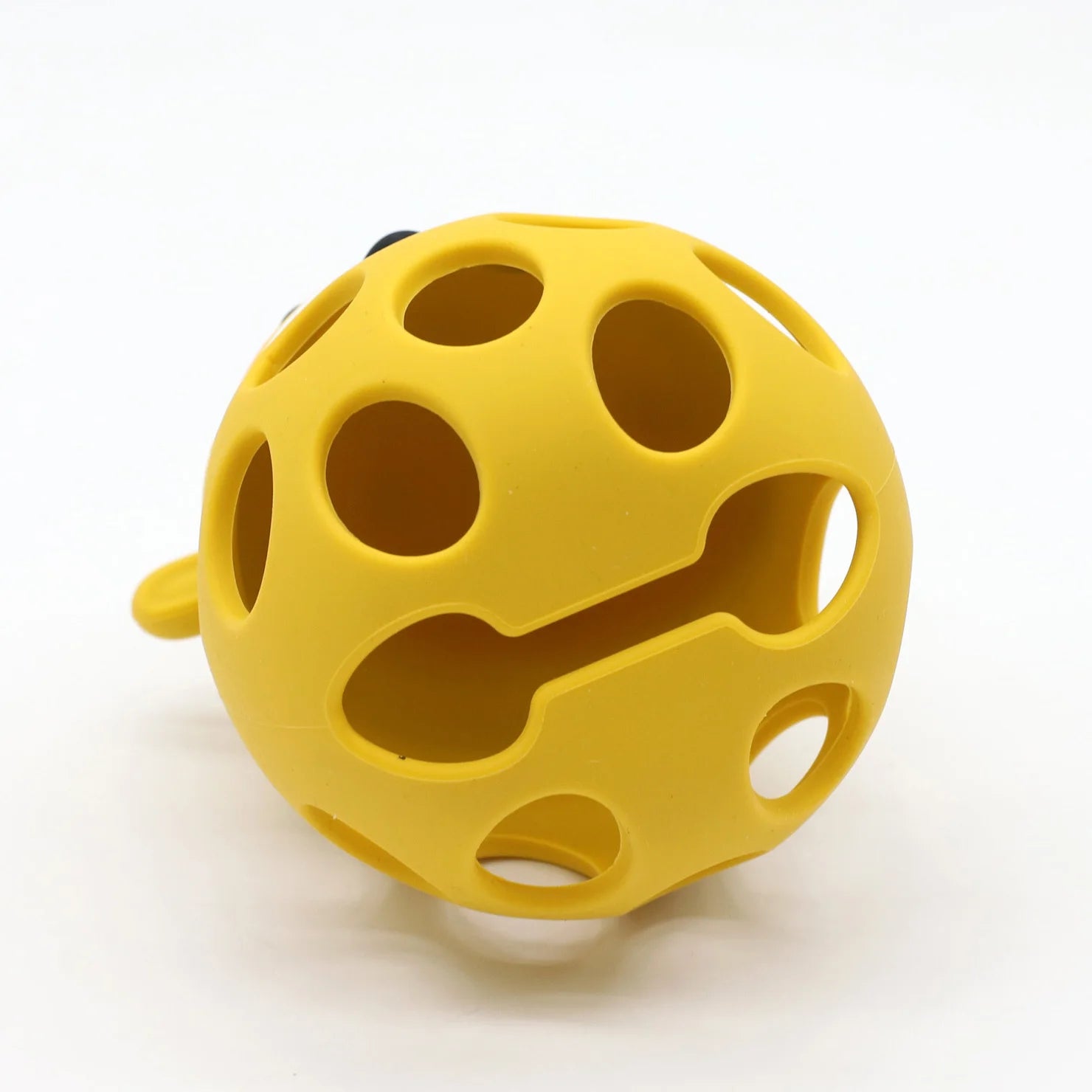 Yellow textured ball on a white background